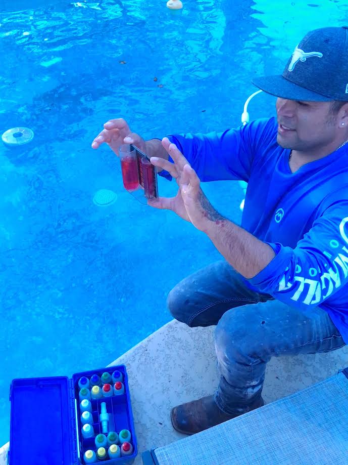 Icy Pools technician testing water chemistry